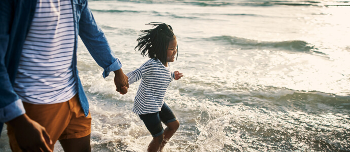 Father walking with happy daugther