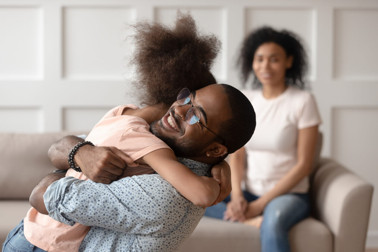 Father hugging daughter