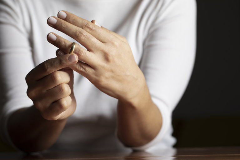 Woman taking her wedding ring off