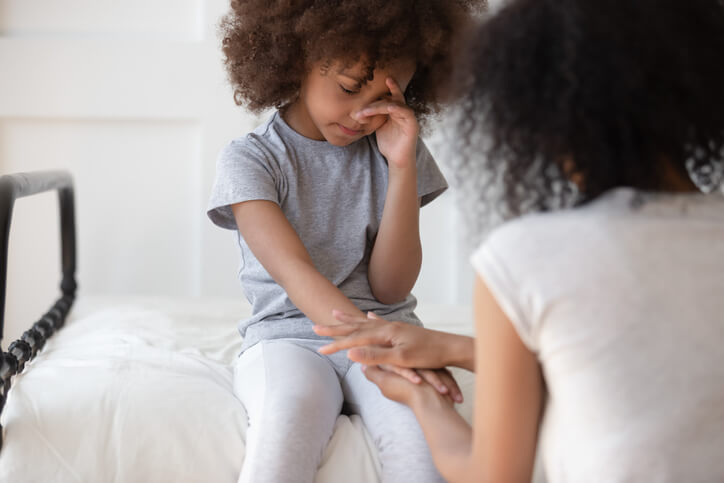 Mother comforting child