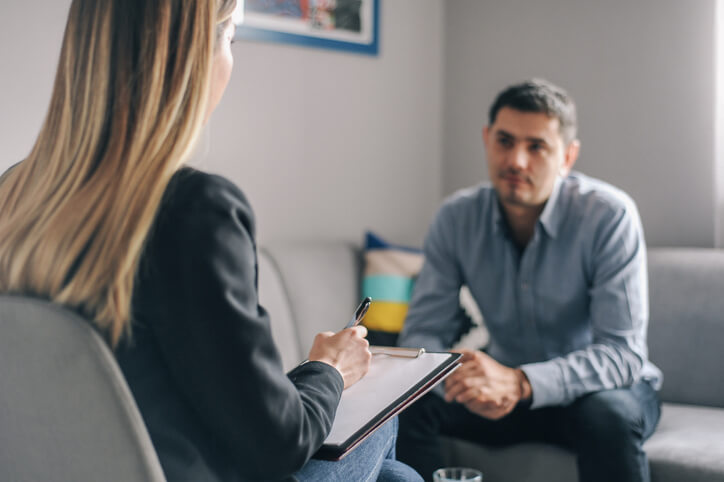 Client sitting with family law attorney