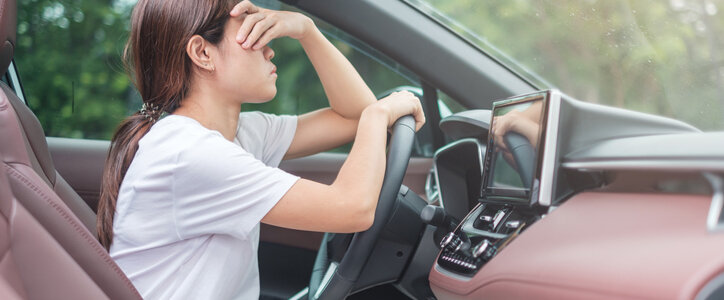 woman feeling stress and angry during drive car long time. Asian girl tired and fatigue having headache stop after driving car in traffic jam. Sleepy, stretching and drunk concept in north carolina