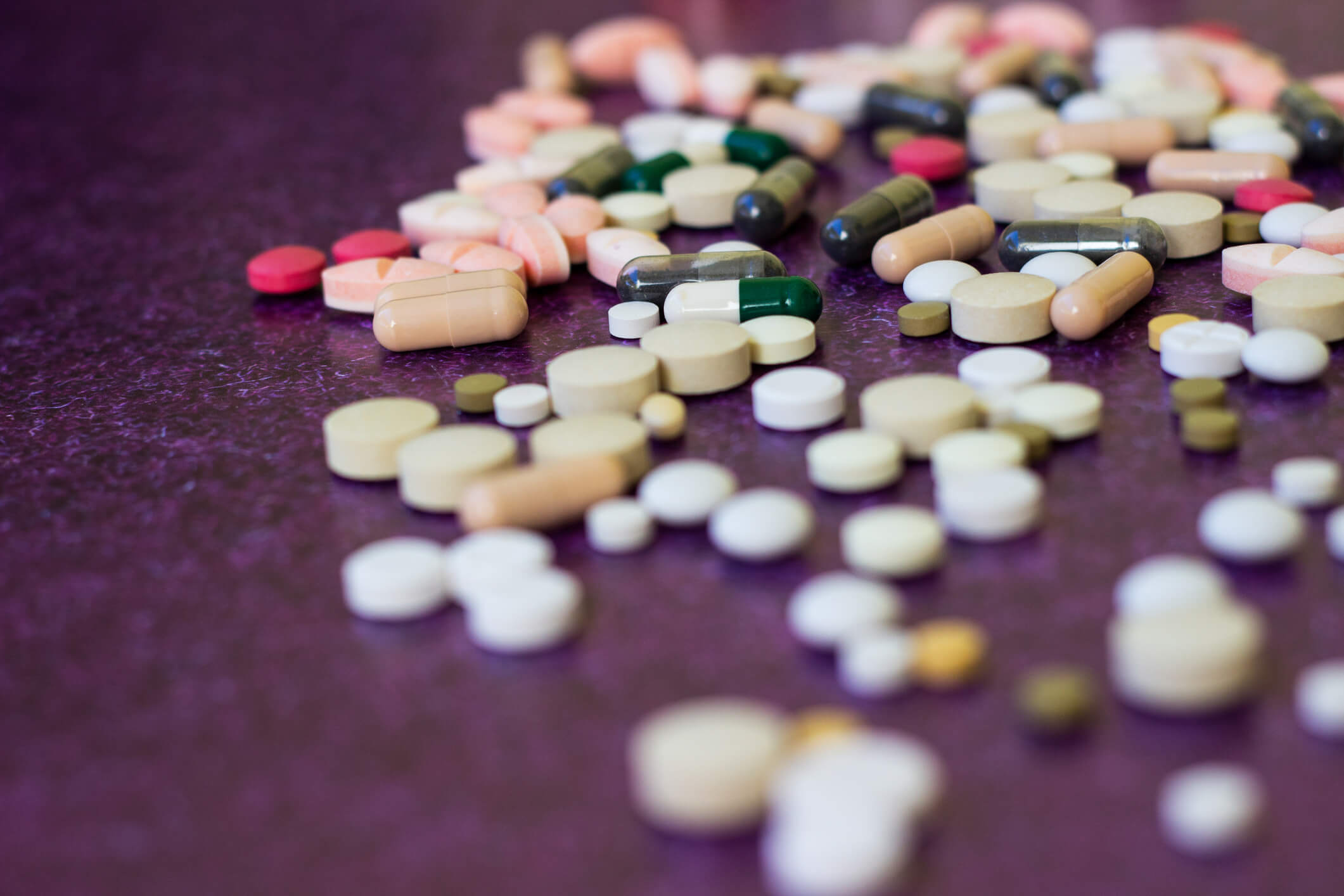 Heap of medicine pills. Close up of colorful tablets and capsules