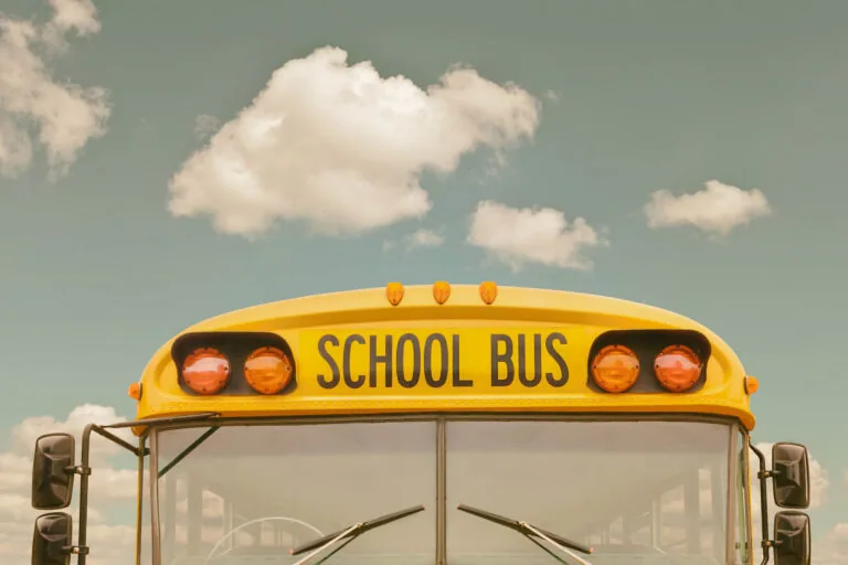 Retro styled image of an old American yellow school bus in north carolina